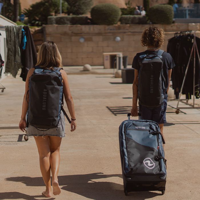 Two divers on their way to the dive centers with Aqualung dive gear